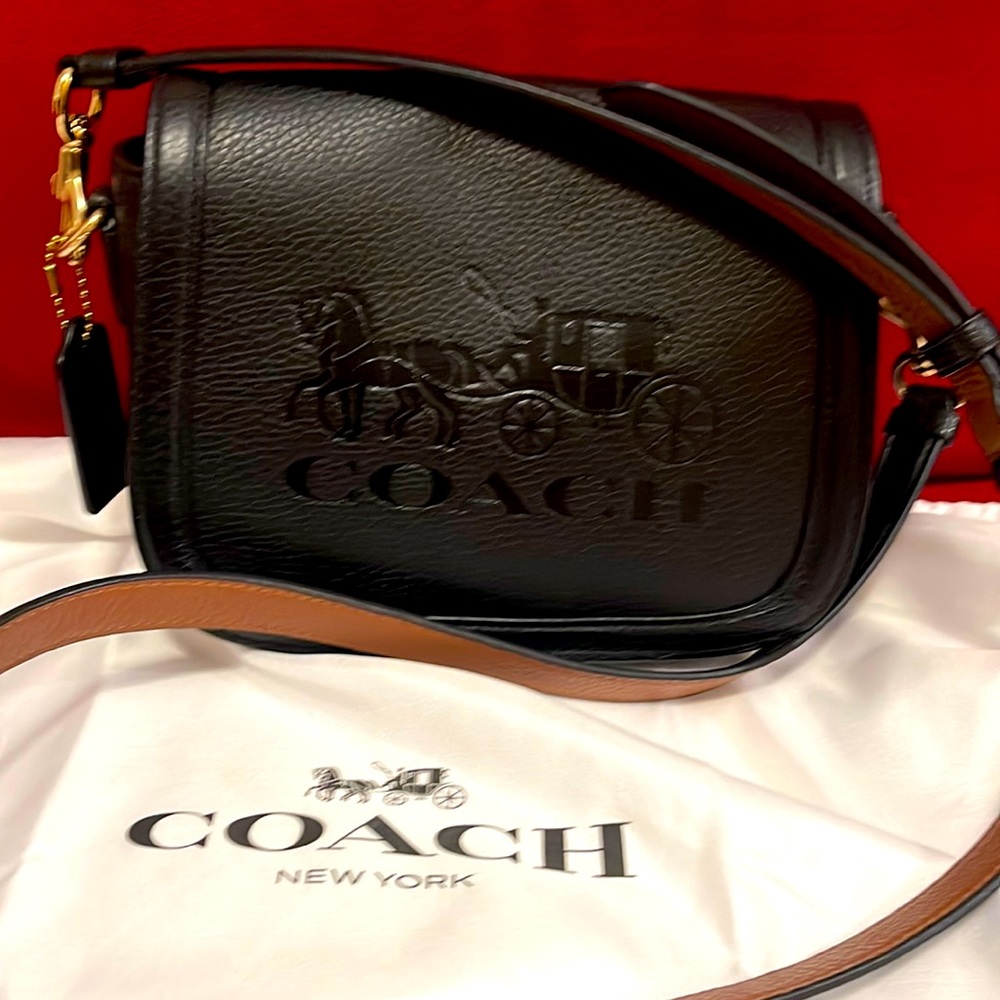 Beautiful classics black Coach crossbody. Soft leather/red interior.